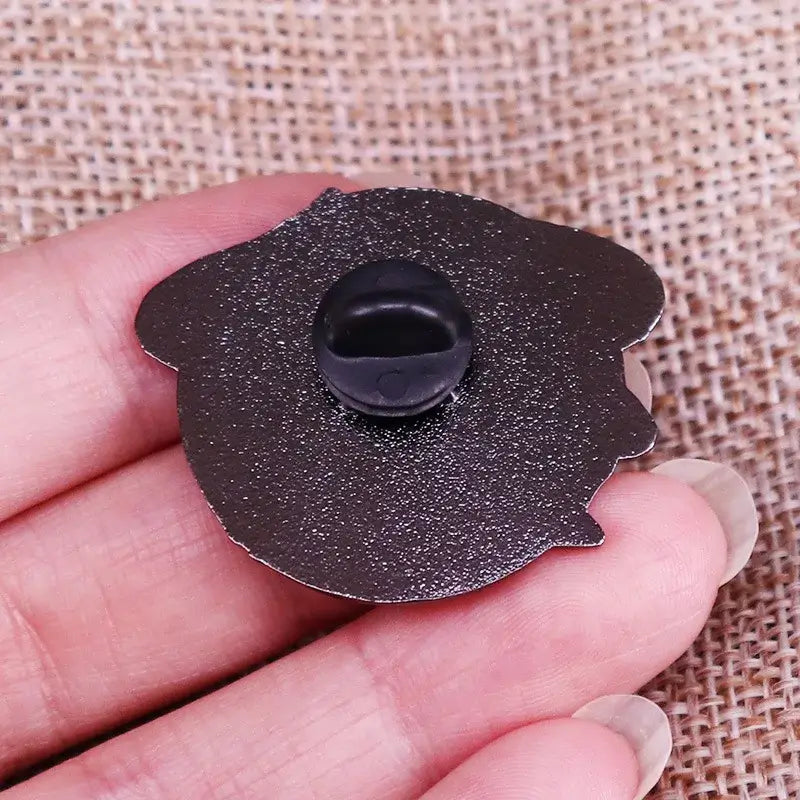 Back of ST-Star X Trek Enamel Pin showing clasp, perfect for securely attaching to bags or jackets.