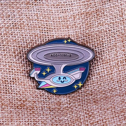 Cute enamel pin featuring a spaceship design with stars, perfect for fashion accessories or gifts.