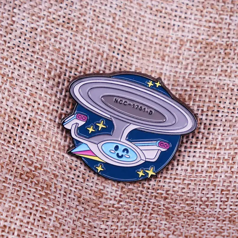 ST-Star X Trek Enamel Pin featuring a spaceship design with stars, perfect for backpacks and fashion accessories.