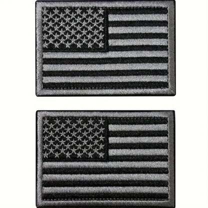 2pcs USA flag embroidered patches in black, featuring detailed stars and stripes design for hats and backpacks.