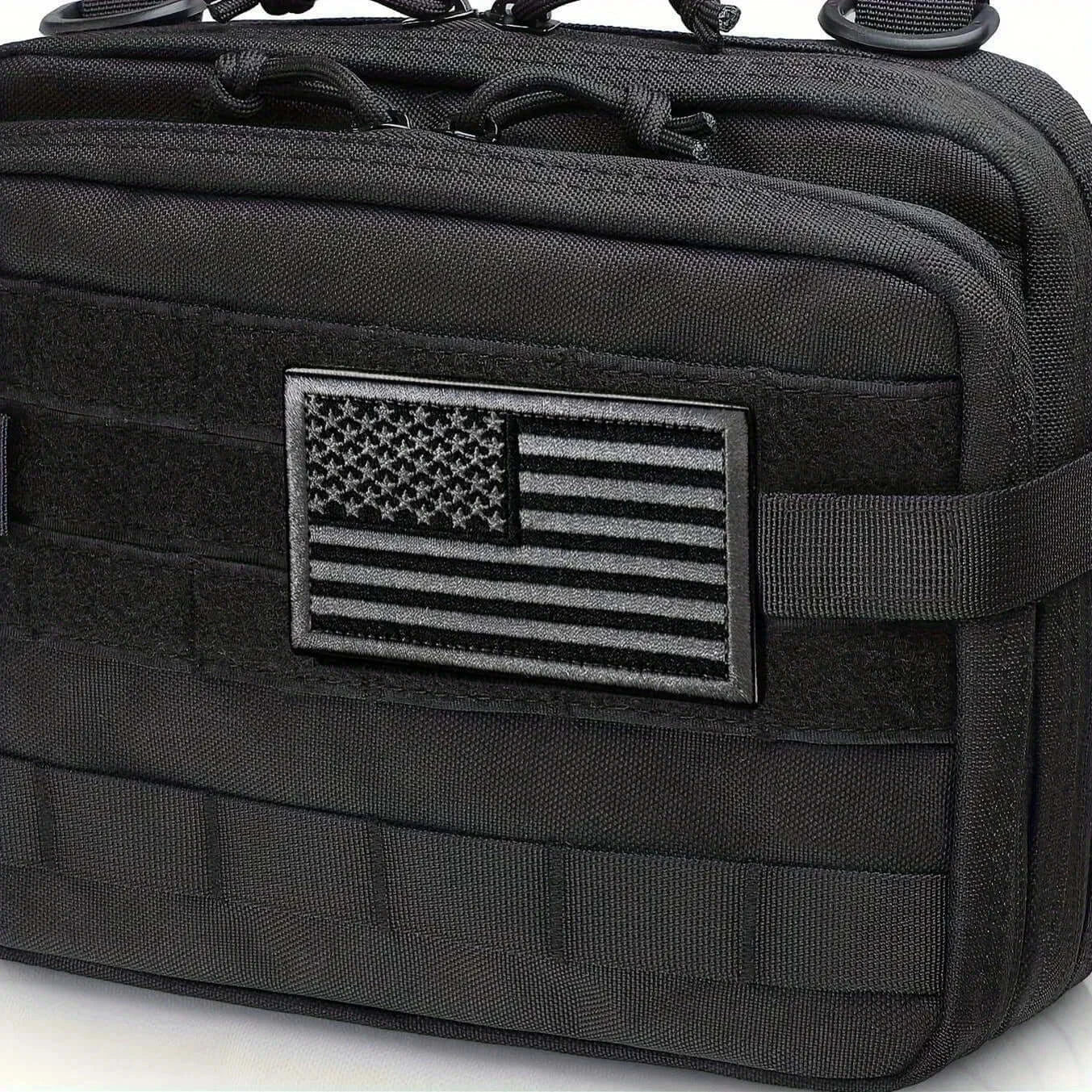 Black American flag patch on tactical bag, ideal for military and outdoor gear.