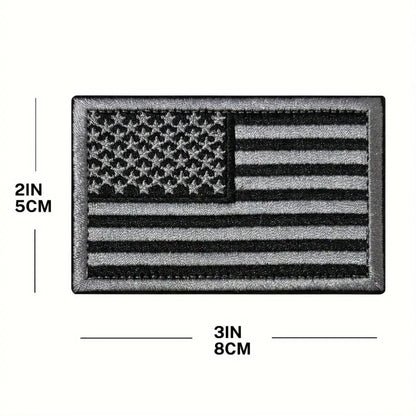Black and gray USA flag embroidered patch, measuring 8cm x 5cm, designed for hats and jackets.